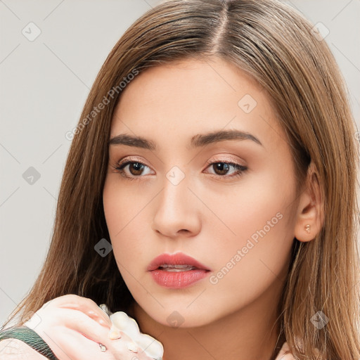 Neutral white young-adult female with long  brown hair and brown eyes