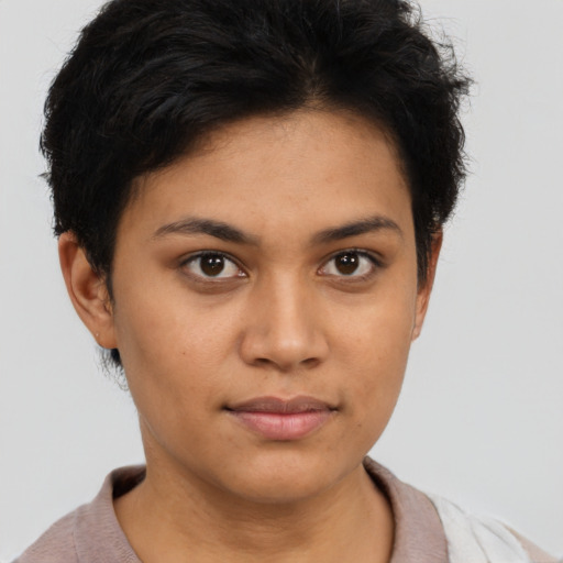 Joyful latino young-adult female with short  brown hair and brown eyes