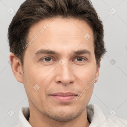 Joyful white adult male with short  brown hair and brown eyes