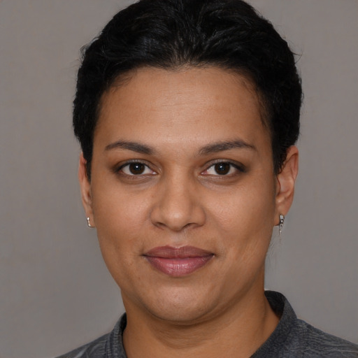 Joyful white young-adult female with short  black hair and brown eyes