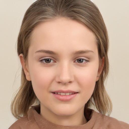 Joyful white child female with medium  brown hair and brown eyes