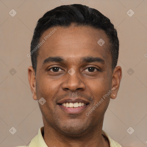 Joyful latino young-adult male with short  black hair and brown eyes