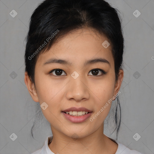 Joyful asian young-adult female with short  black hair and brown eyes