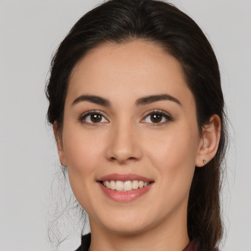 Joyful white young-adult female with medium  brown hair and brown eyes