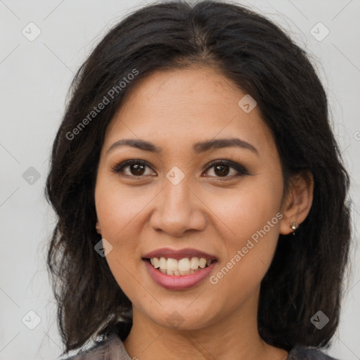 Joyful latino young-adult female with long  brown hair and brown eyes