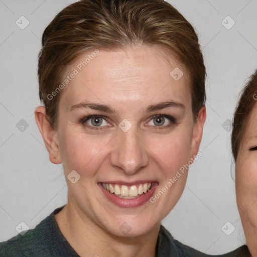 Joyful white young-adult female with medium  brown hair and blue eyes