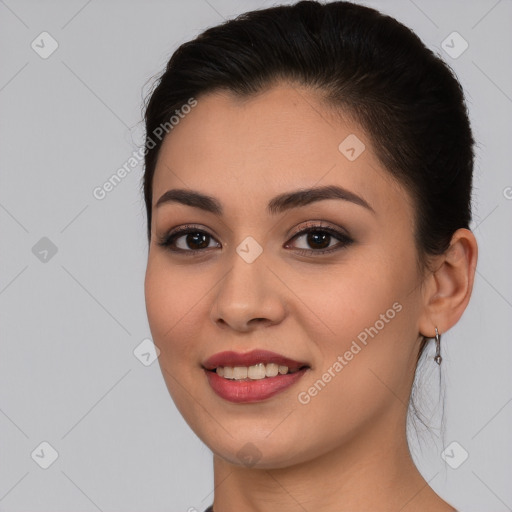 Joyful white young-adult female with long  brown hair and brown eyes