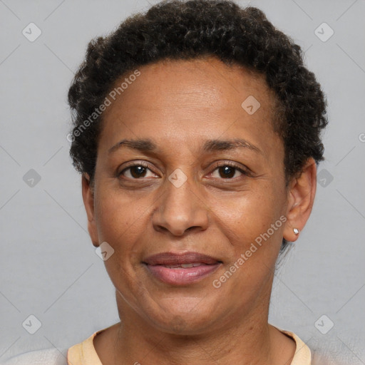 Joyful black adult female with short  brown hair and brown eyes