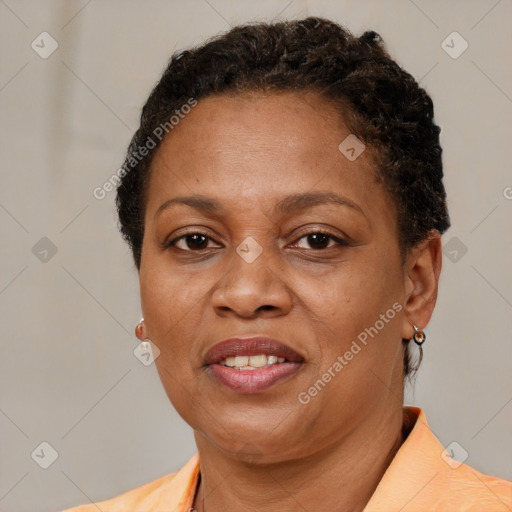 Joyful latino adult female with short  brown hair and brown eyes