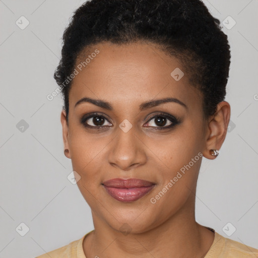 Joyful black young-adult female with short  brown hair and brown eyes