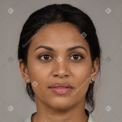 Joyful latino young-adult female with medium  brown hair and brown eyes