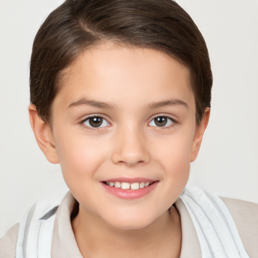 Joyful white child female with short  brown hair and brown eyes