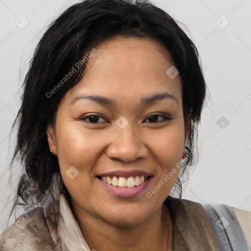 Joyful asian young-adult female with long  brown hair and brown eyes