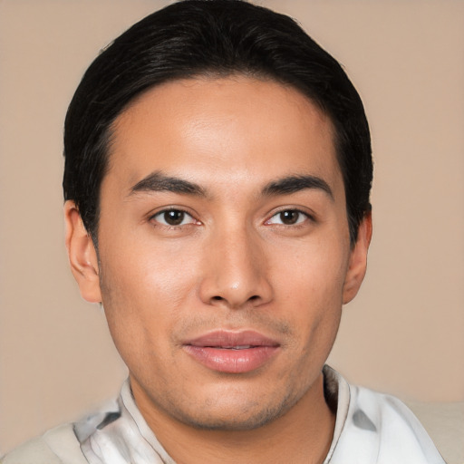 Joyful asian young-adult male with short  brown hair and brown eyes