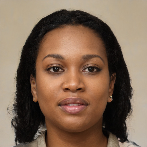 Joyful black young-adult female with medium  black hair and brown eyes