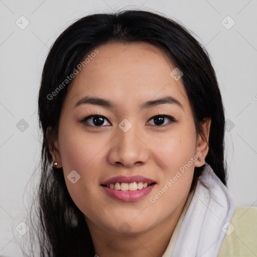 Joyful latino young-adult female with long  brown hair and brown eyes