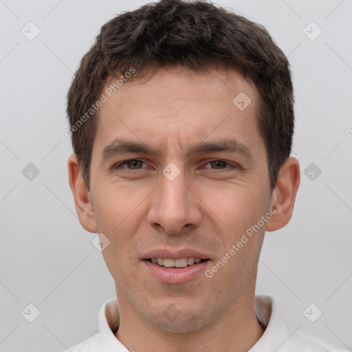 Joyful white young-adult male with short  brown hair and brown eyes