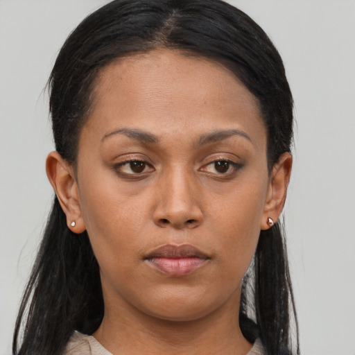 Neutral black young-adult female with long  brown hair and brown eyes