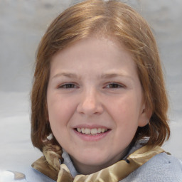 Joyful white child female with medium  brown hair and brown eyes