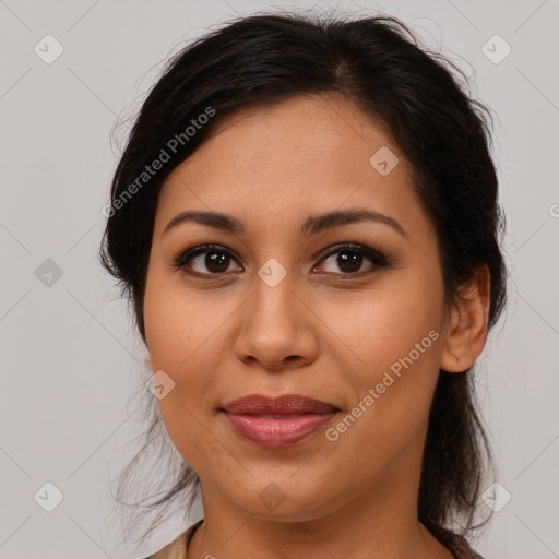 Joyful latino young-adult female with medium  brown hair and brown eyes