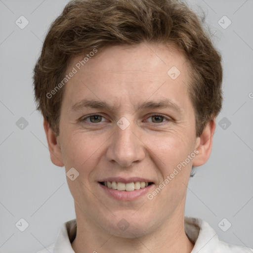 Joyful white adult male with short  brown hair and grey eyes