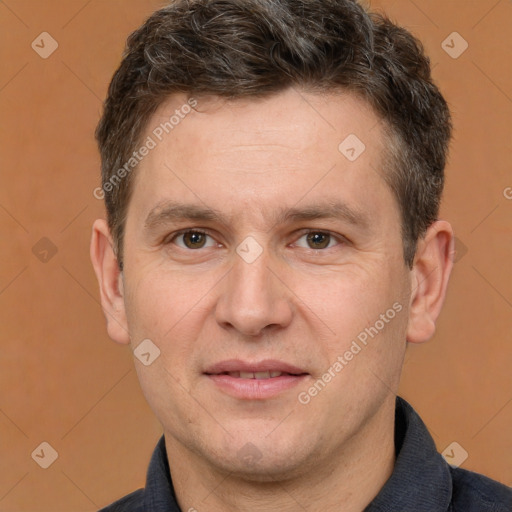 Joyful white adult male with short  brown hair and brown eyes