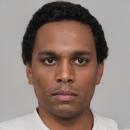 Neutral black young-adult male with short  black hair and brown eyes