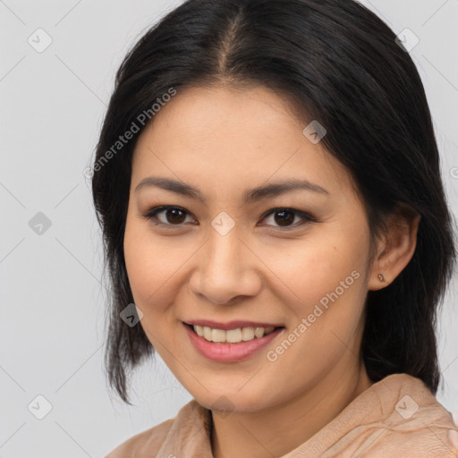 Joyful latino young-adult female with medium  brown hair and brown eyes