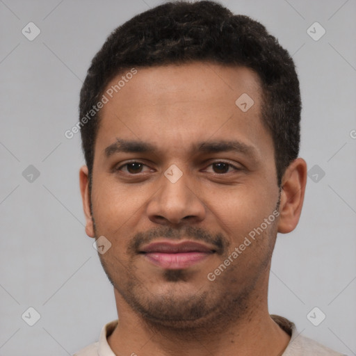 Joyful latino young-adult male with short  brown hair and brown eyes