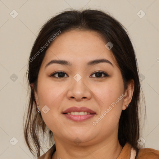 Joyful latino young-adult female with medium  brown hair and brown eyes