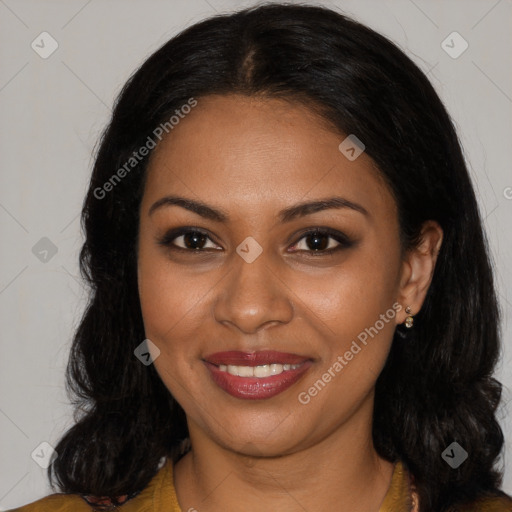 Joyful black young-adult female with long  brown hair and brown eyes