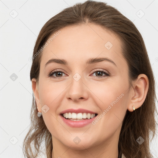 Joyful white young-adult female with long  brown hair and grey eyes