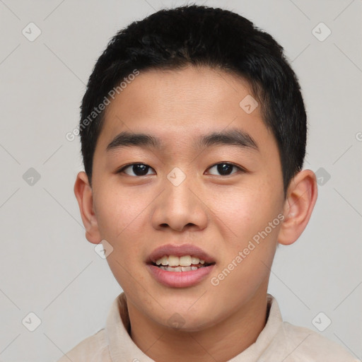 Joyful asian young-adult male with short  black hair and brown eyes