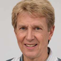 Joyful white middle-aged male with short  brown hair and brown eyes