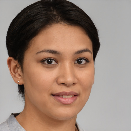 Joyful white young-adult female with medium  brown hair and brown eyes