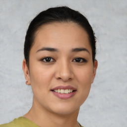 Joyful asian young-adult female with short  brown hair and brown eyes