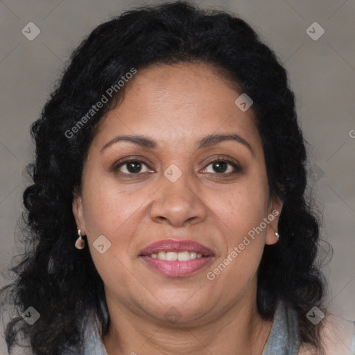 Joyful black adult female with long  brown hair and brown eyes