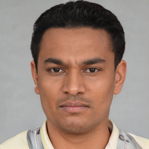 Neutral latino young-adult male with short  black hair and brown eyes