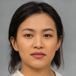 Joyful asian young-adult female with medium  brown hair and brown eyes