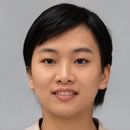Joyful asian young-adult female with medium  black hair and brown eyes