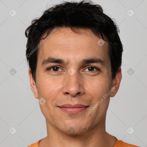 Joyful white young-adult male with short  black hair and brown eyes