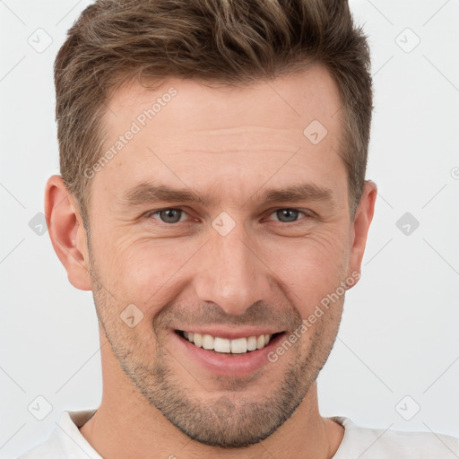 Joyful white young-adult male with short  brown hair and brown eyes