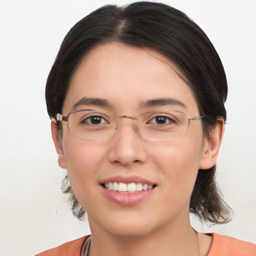 Joyful white young-adult female with medium  brown hair and brown eyes