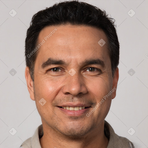 Joyful white adult male with short  black hair and brown eyes