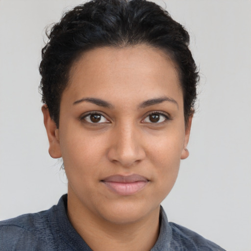 Joyful latino young-adult female with short  brown hair and brown eyes