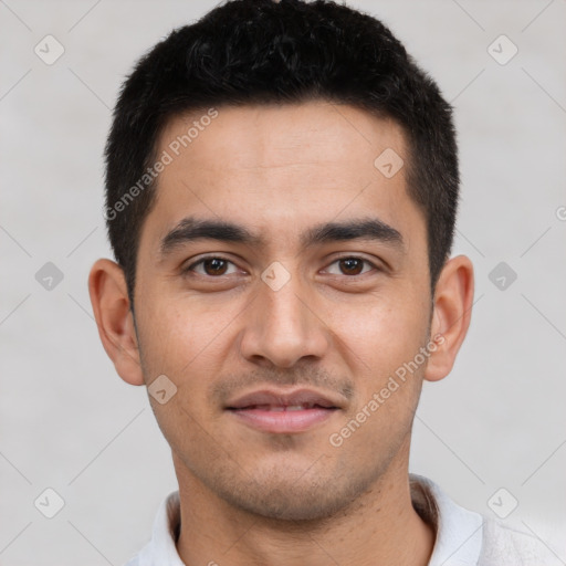 Joyful latino young-adult male with short  black hair and brown eyes