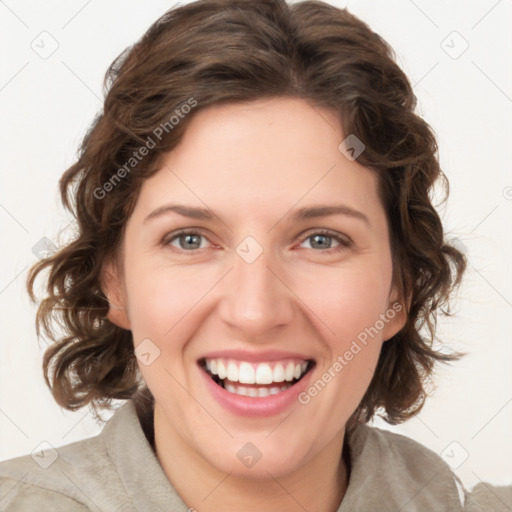 Joyful white young-adult female with medium  brown hair and green eyes