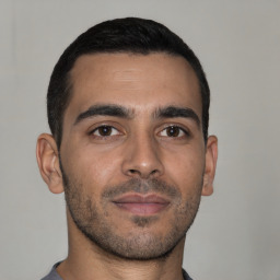 Neutral latino young-adult male with short  brown hair and brown eyes