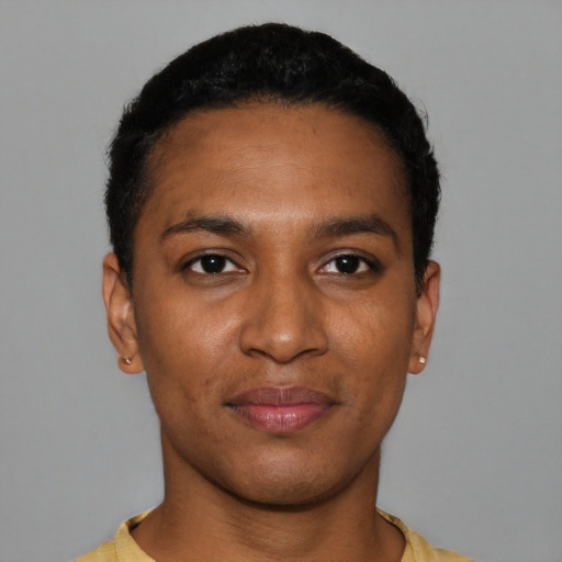 Joyful black young-adult male with short  black hair and brown eyes