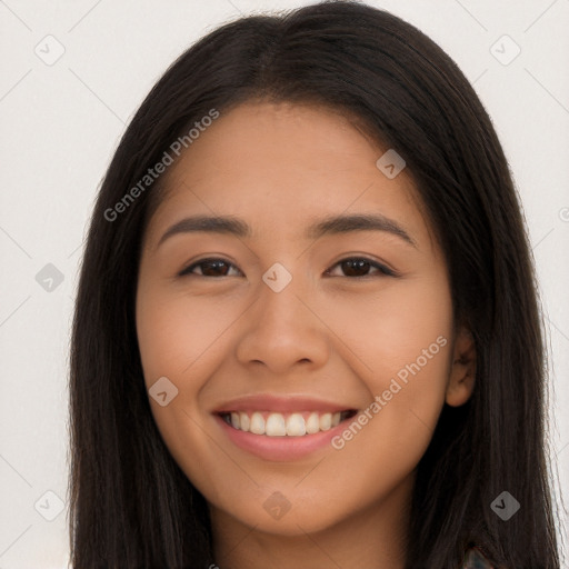 Joyful latino young-adult female with long  brown hair and brown eyes